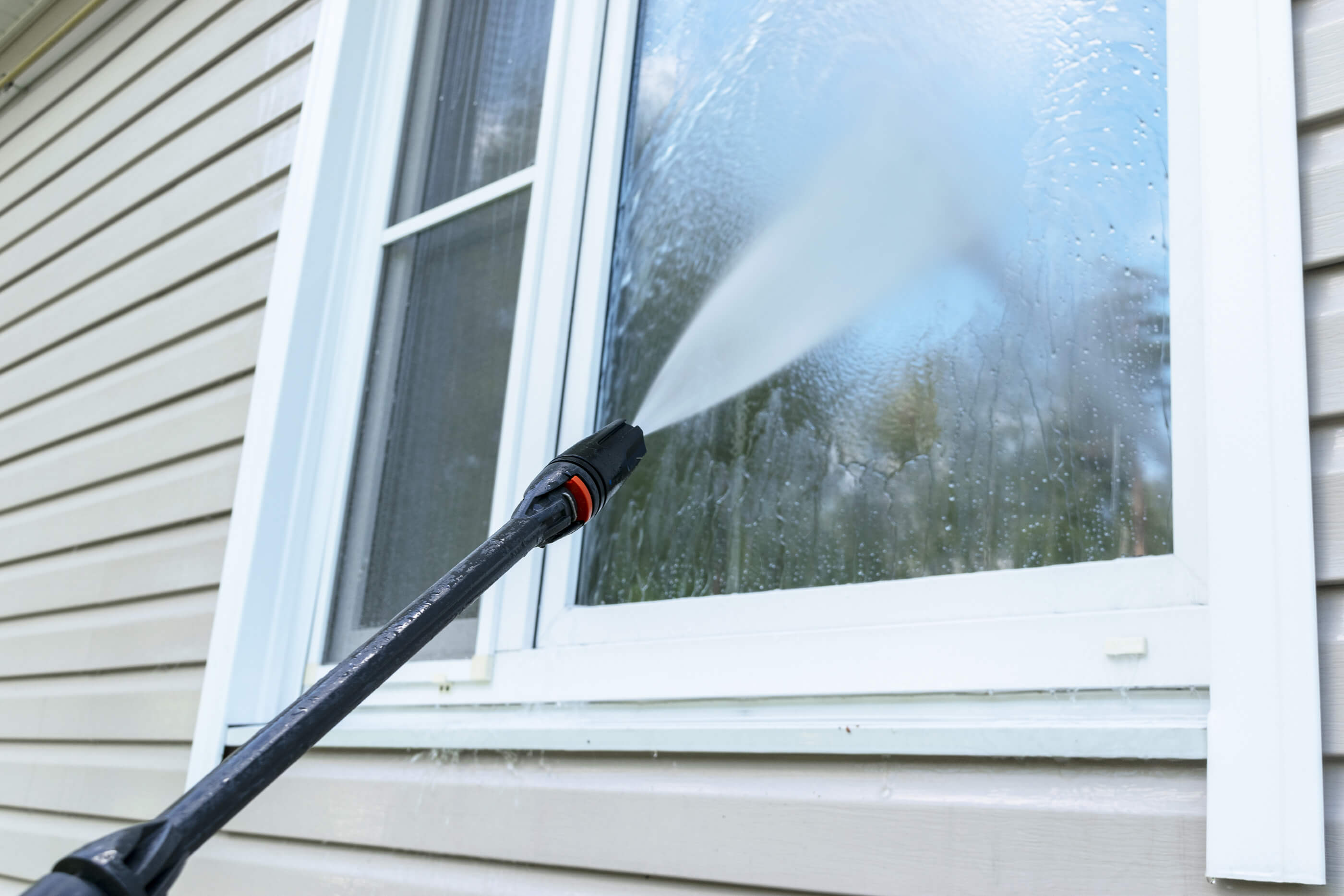 Professional window cleaning by Extreme Clean Pressure Washing - Restoring the Beauty of Your Home's Exterior in Hartford County, Connecticut